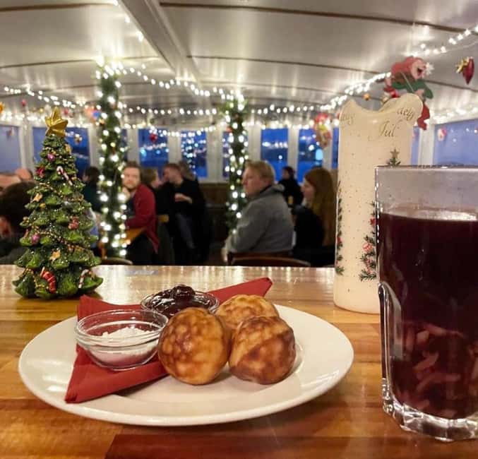 Aarhus: Christmas Harbour Cruise with Local Guide - Onboard comfort: bar, cozy seating, and well-kept toilets