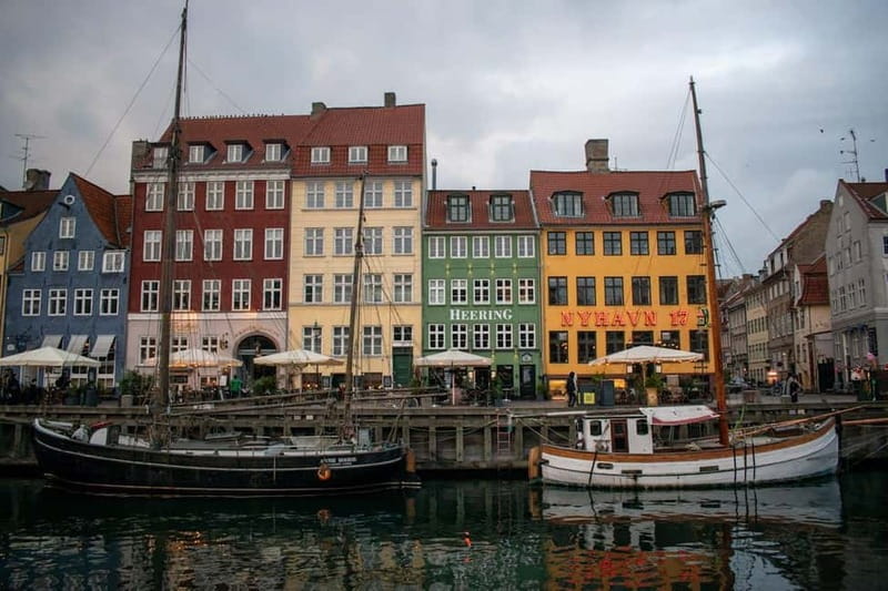 The gabled merchant houses and moored wooden boats of Nyhavn, Copenhagen