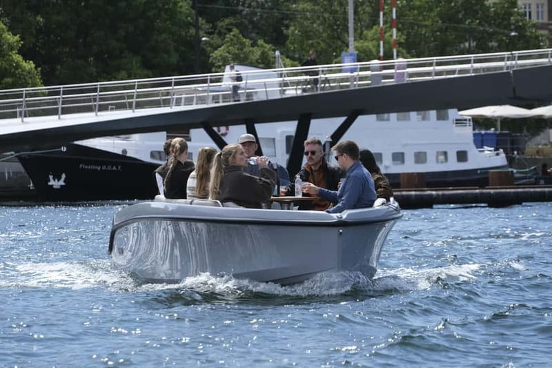 Copenhagen: Electric Canal Tour with Guide and Hot Drink - Børsen and Christianshavn: the parts you notice once you’re afloat