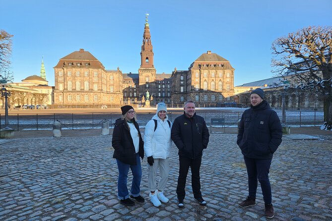 Walk & Canal Tour: Copenhagen Highlights + Changing of the Guards - Passing the Old Stock Exchange after a major fire